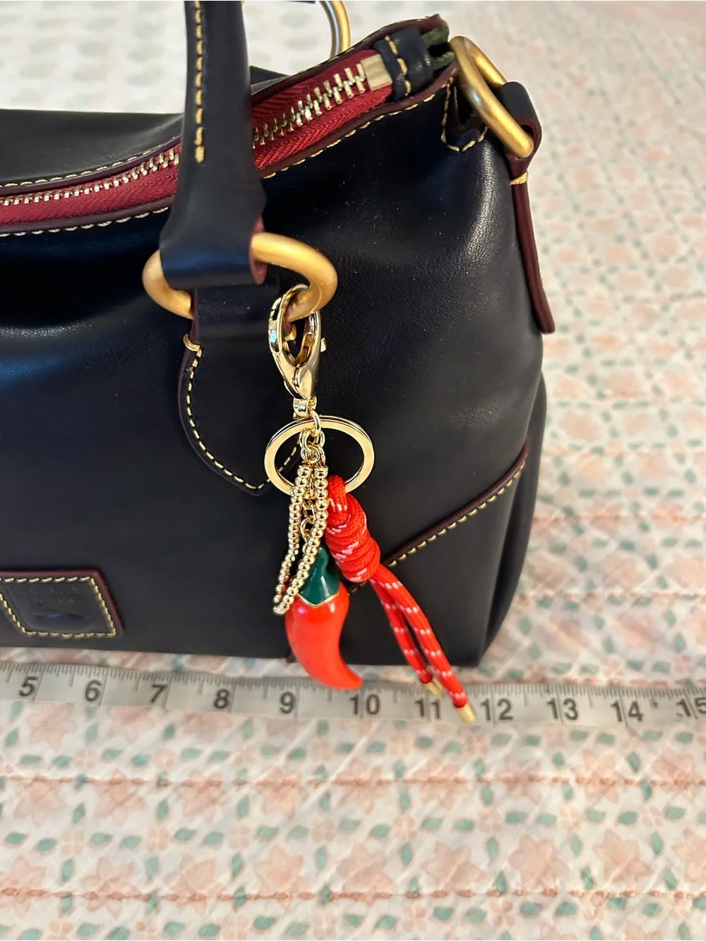 Dooney and Bourke Florentine Satchel 30 in the color Navy. EUC comes w/bag charm